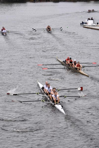 Alumni fours race down the Charles River, as photographed on Oct. 21, 2023 (Hustler Multimedia/Amelia Simpson)