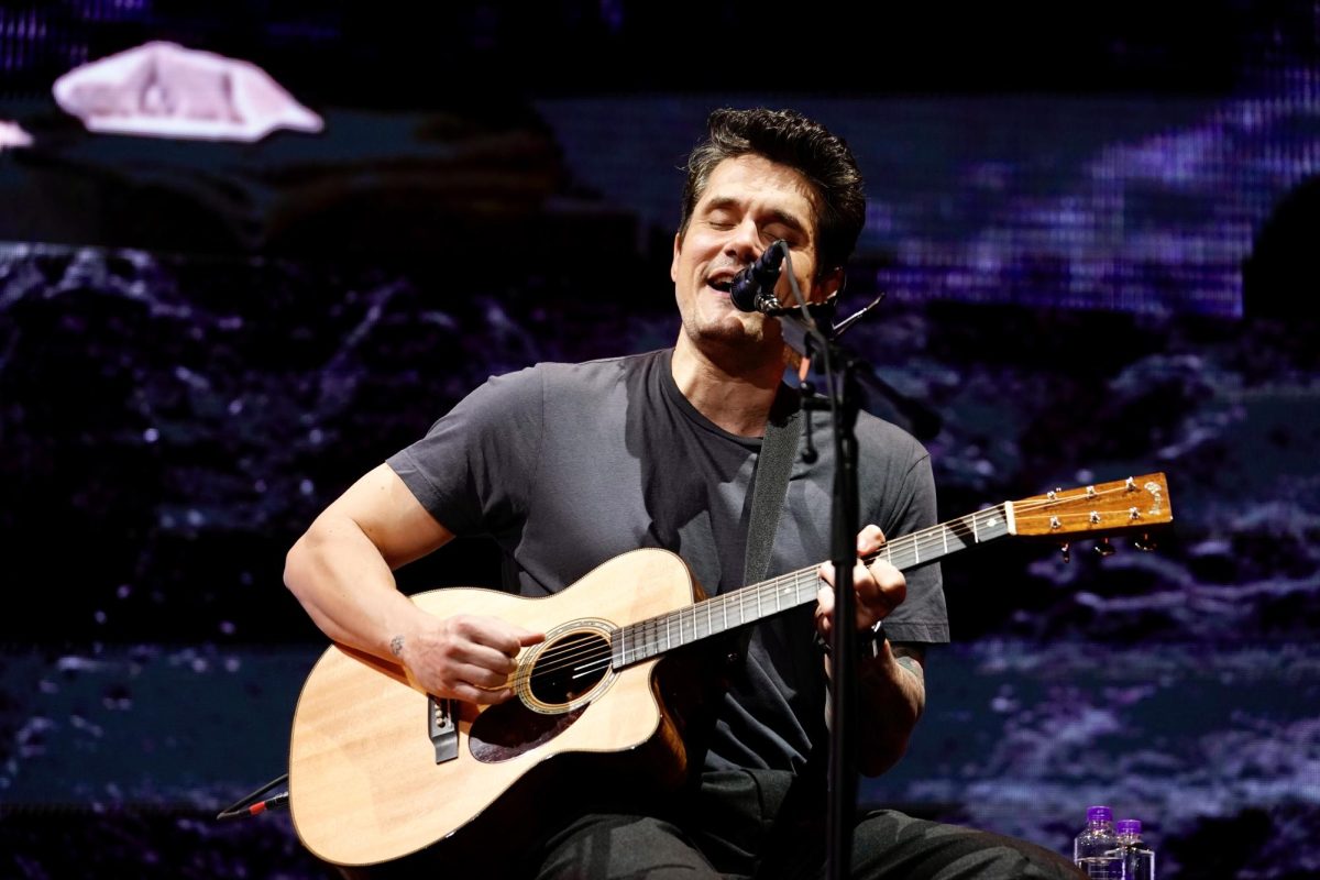 John Mayer smiles while singing to the audience, as photographed on Oct. 11, 2023 (Hustler Multimedia/Sara West)