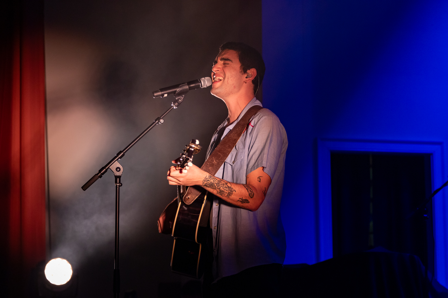 Adam Melchor sings into the microphone at Riverside Revival, as photographed Nov. 6, 2023. (Hustler Multimedia/Barrie Barto)