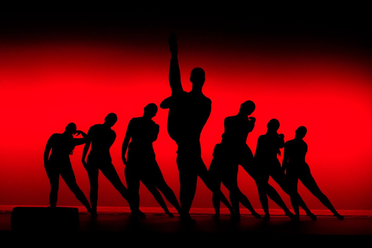 Silhouettes of dancers during their group routine, “Feelin’ Good,” as photographed on Nov. 7, 2023. (Hustler Multimedia/Olivia Noell)
