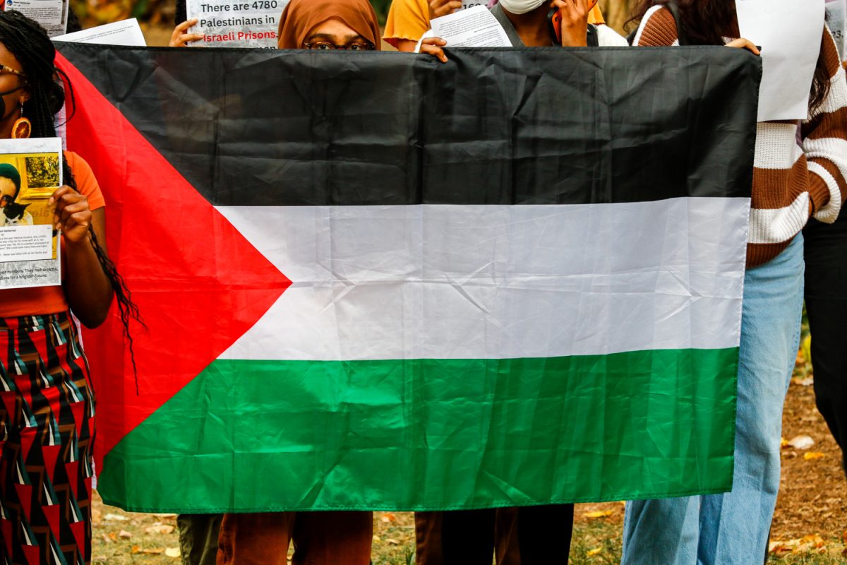 Students hold Palestinian flag at rally, as photographed Oct. 27, 2023. (Hustler Multimedia/Barrie Barto)