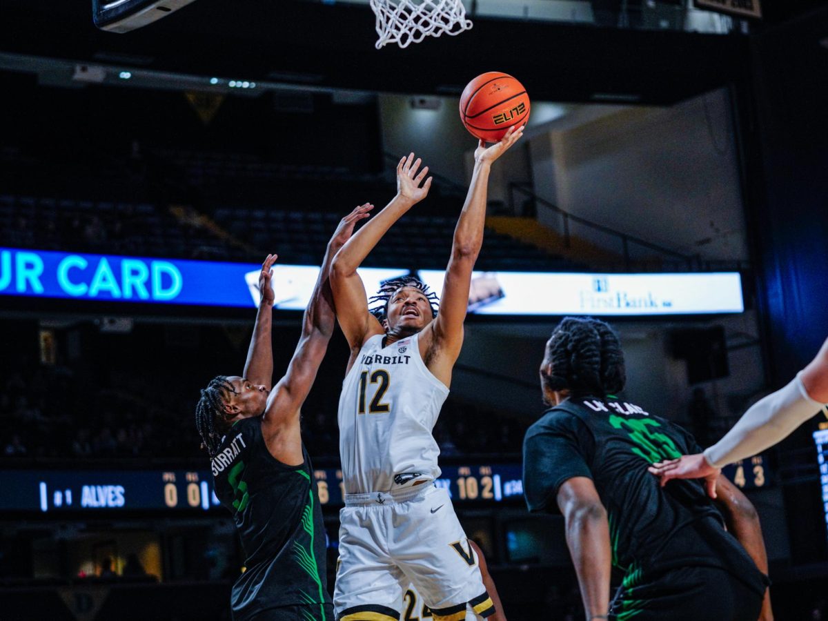 Evan Taylor reaches for the net with the ball during Vanderbilt’s game vs USC Upstate, as photographed on Nov. 10, 2023. (Hustler Multimedia/Ophelia Lu)