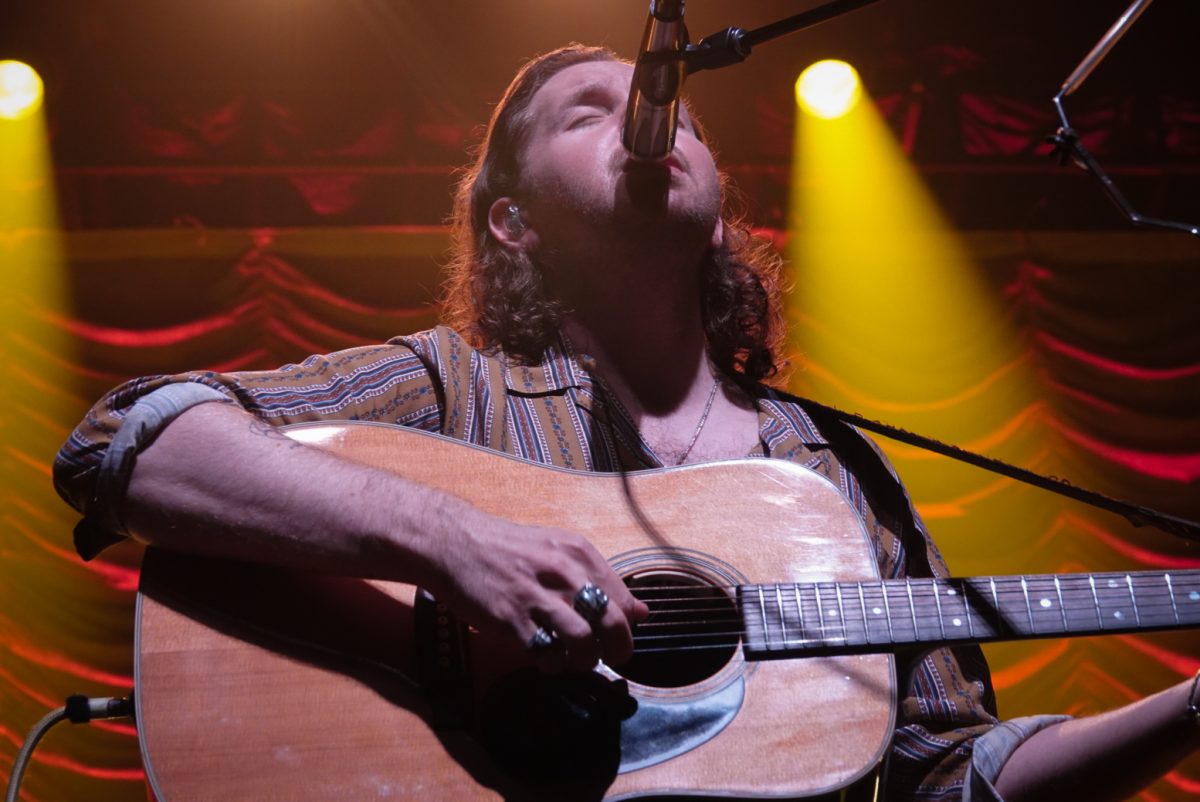 Sam Bentler plays the guitar as he sings, as photographed on Nov. 6, 2023. (Hustler Multimedia/Sofia Healy)
