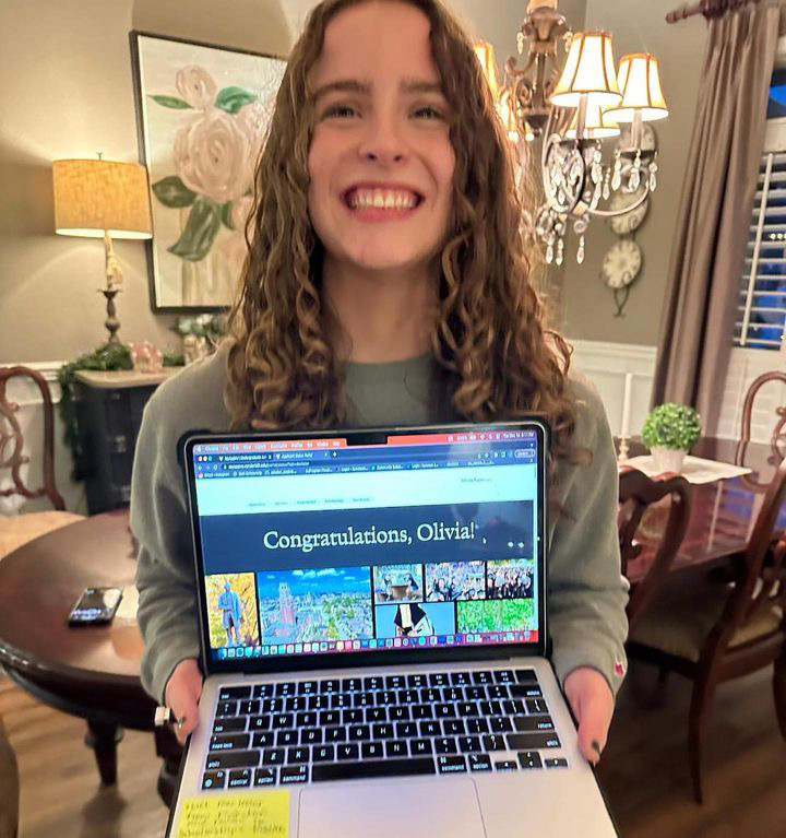 Olivia Ryan holding up her acceptance to Vanderbilt, as photographed on Dec. 14, 2023. (Photo courtesy of Olivia Ryan)