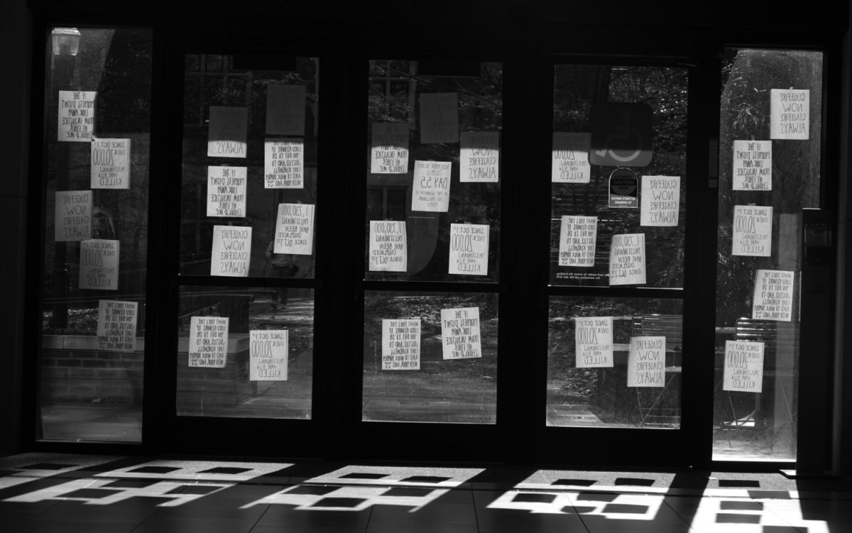 Protest flyers taped to the glass doors of the Benton Chapel lobby, as photographed on Nov. 30, 2023. (Hustler Multimedia/George Albu)