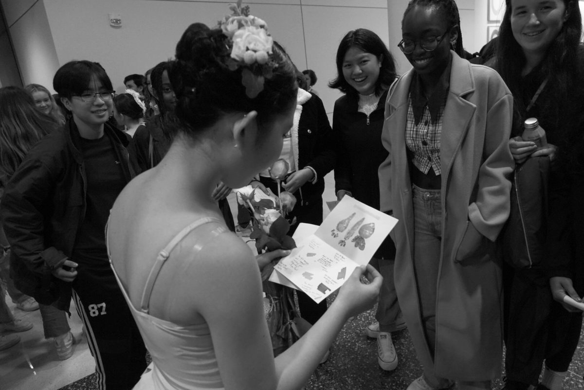 Ballerina Angela Kakaruk opens a card presented to her by her fellow neighbors at East House, as photographed on Dec. 2, 2023. (Hustler Multimedia/George Albu)