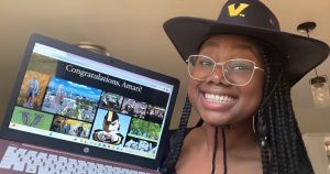 Amari Larry, an incoming first-year, holds up her acceptance letter from Vanderbilt on Dec. 14, 2023. (Photo courtesy of Amari Larry)