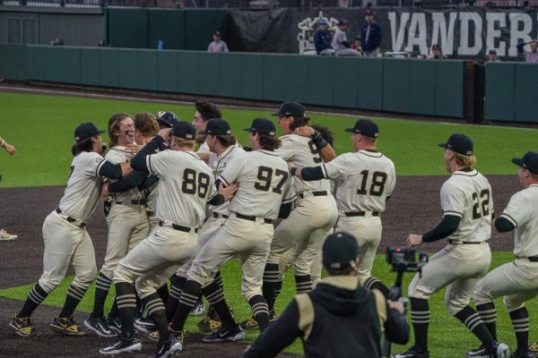 The team storms the field after Vanderbilts walk-off victory over FAU, as photographed on Feb. 16, 2024. (Hustler Multimedia/Josh Rehders)