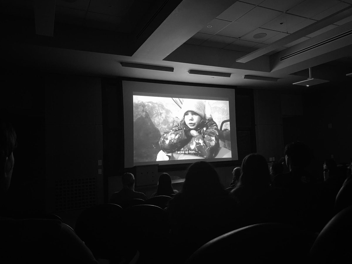 Students watch “20 Days in Mariupol” on a projector screen in Buttrick Hall, as photographed on Feb. 23, 2024. (Hustler Multimedia/Salma Elhandaoui)