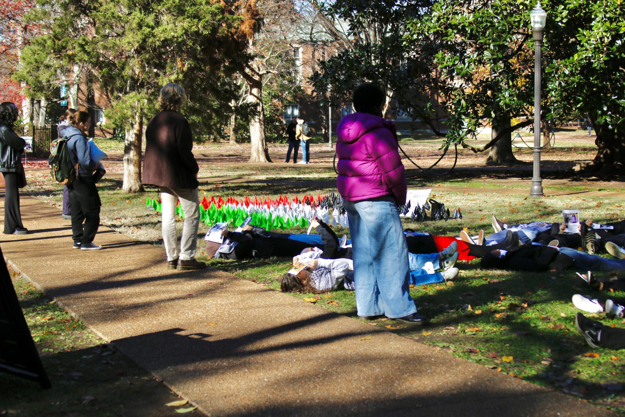 Students observe a “die-in” for Palestine, as photographed on Dec. 7, 2023.  (Hustler Multimedia/Barrie Barto). 