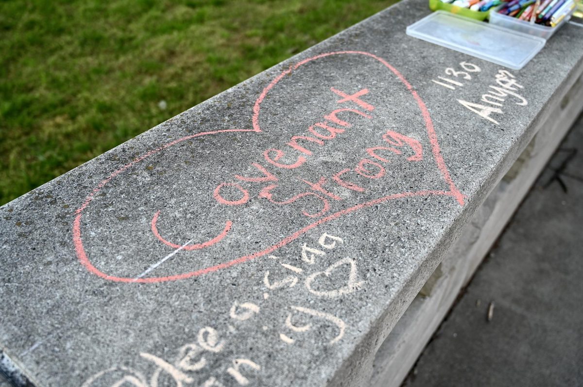 Chalk-art written on the walls around Centennial Park reading Covenant Strong. (Hustler Multimedia/Alysa Suleiman)