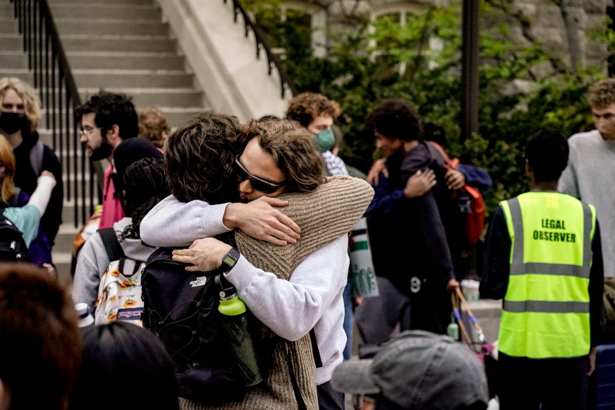 Student protesters embracing on the steps of Kirkland Hall, as photographed on March 27, 2024. (Hustler Multimedia/Miguel Beristain)