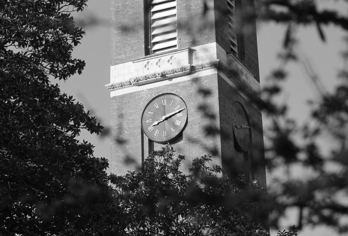 Black-and-white photograph of Kirkland Hall captured through branches in the foreground, as photographed on March 22, 2024. (Hustler Multimedia/George Albu)