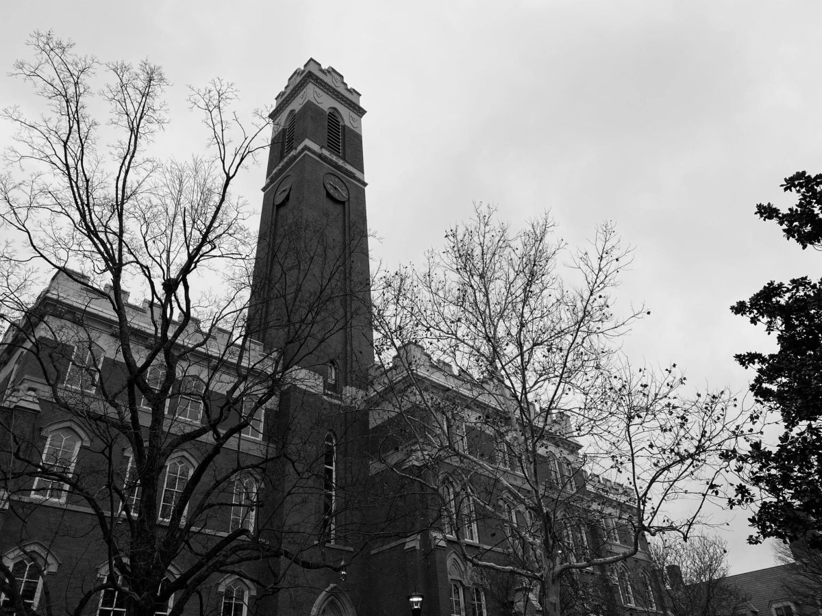 Photograph of Kirkland Halls tower behind trees on a cloudy afternoon, as photographed on Jan. 7, 2024. (Hustler Multimedia/George Albu)