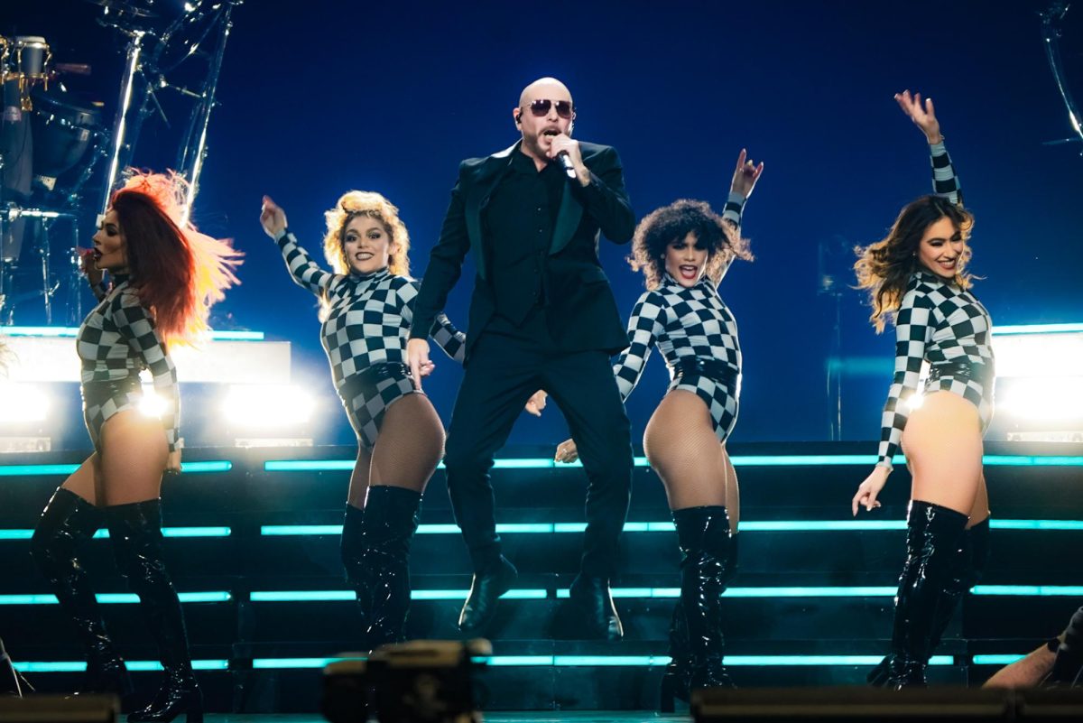 Pitbull jumps down the stairs on stage during his performance, as photographed on Feb. 28, 2024. (Hustler Multimedia/Nikita Rohila)