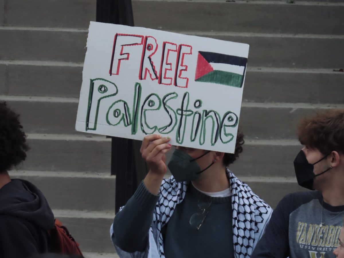 Student holds Free Palestine sign at send-off rally, as photographed on March 27, 2024. (Hustler Multimedia/Isabella Bautista)