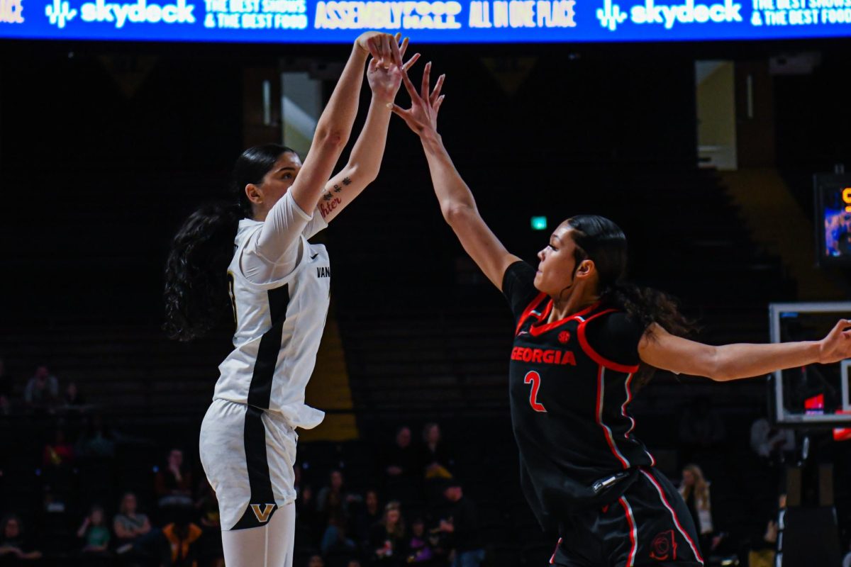 Justine Pissot launches the ball from the 3-point line as a defender reaches to block, as captured on March 3, 2024. (Hustler Multimedia/Savannah Walske)