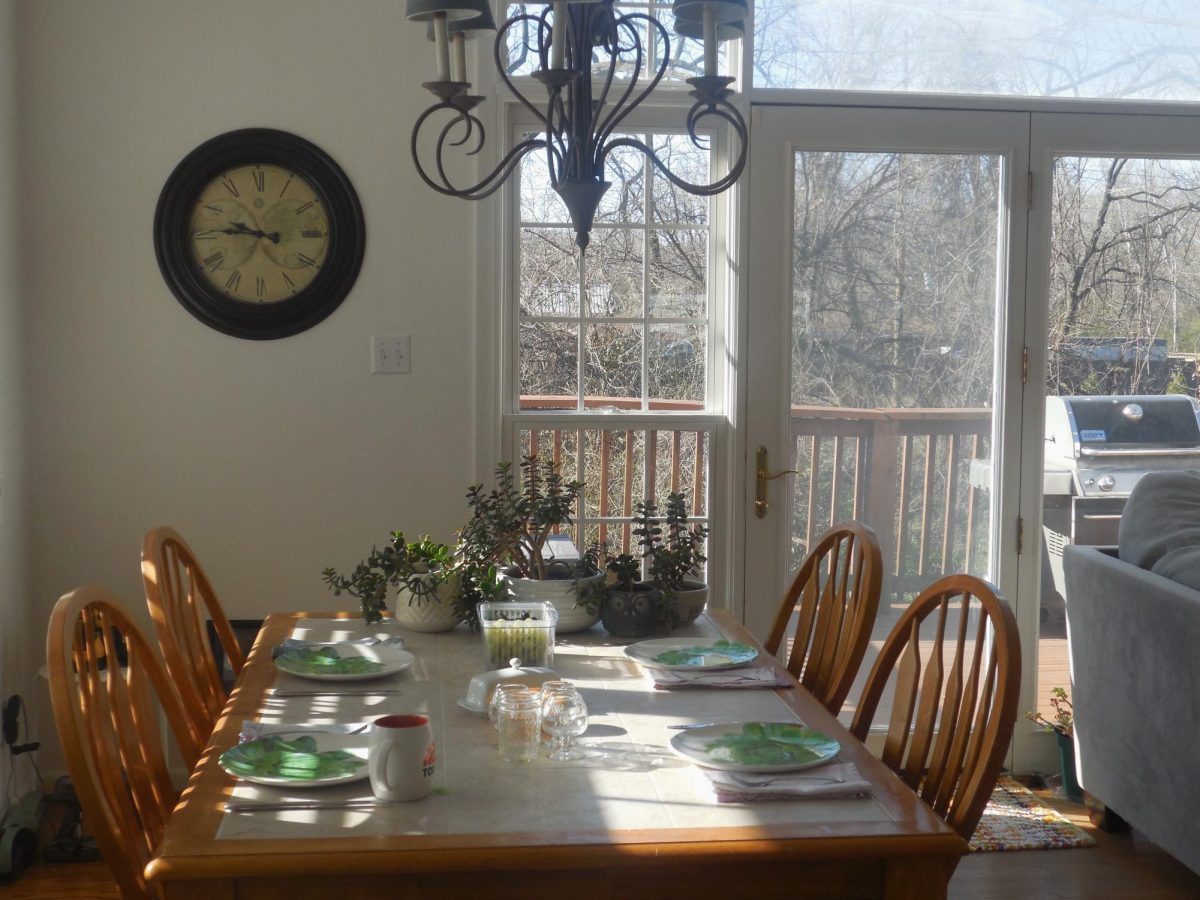 Kitchen table set for breakfast shot with sun shining through windows, as photographed on March 16, 2024. (Hustler Multimedia/Abby Hoelscher)