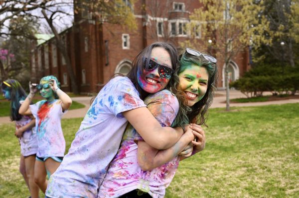 Students pose while covered in colorful powder to celebrate Holi, as photographed on March 31, 2024. (Hustler Multimedia/Alysa Suleiman)