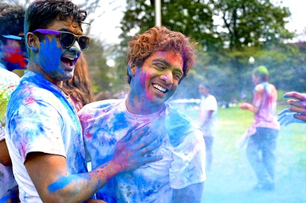 Students throw colorful powder to celebrate Holi, as photographed on March 31, 2024. (Hustler Multimedia/Alysa Suleiman)