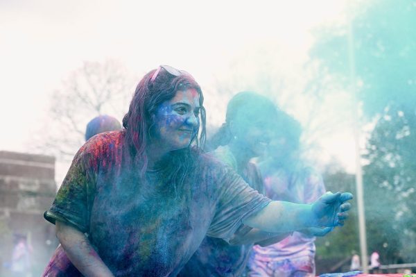 Students throw colorful powder to celebrate Holi, as photographed on March 31, 2024. (Hustler Multimedia/Alysa Suleiman)