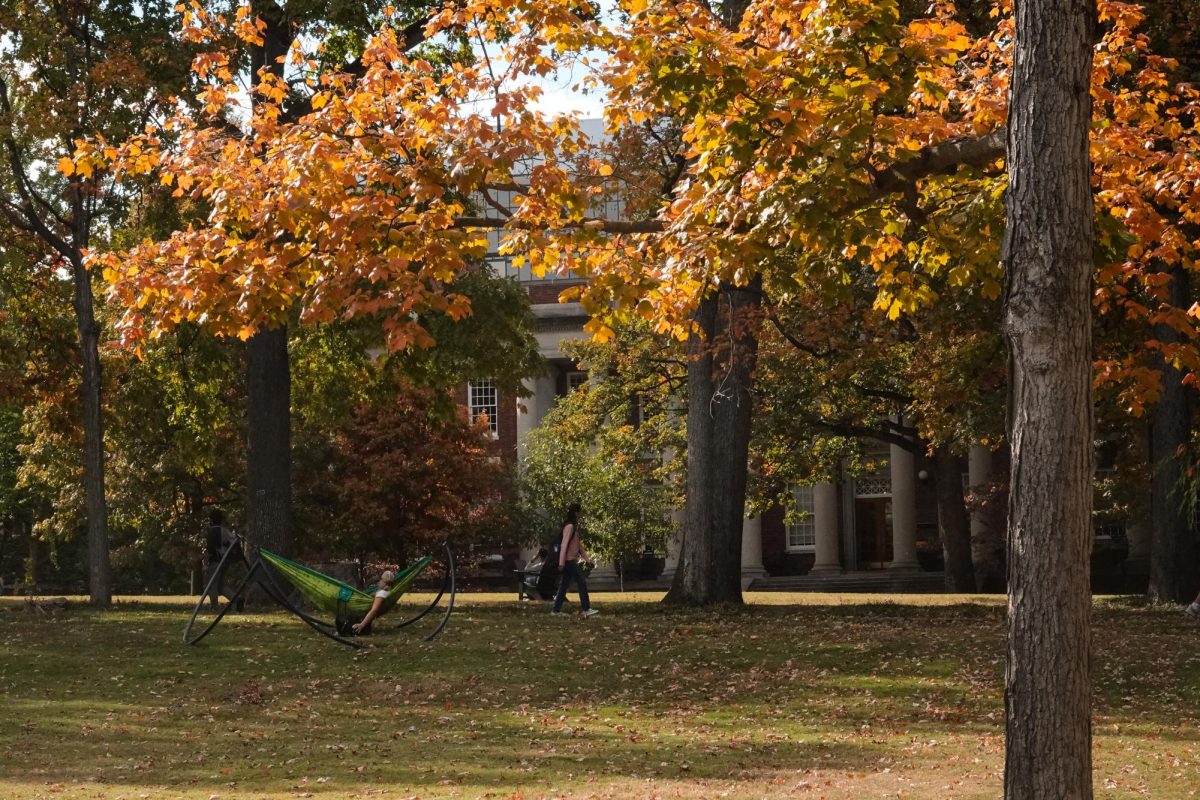 Student reads in hammock on lower quad in commons, as photographed Oct. 24, 2023. (Payton Ohler / Hustler Multimedia)
