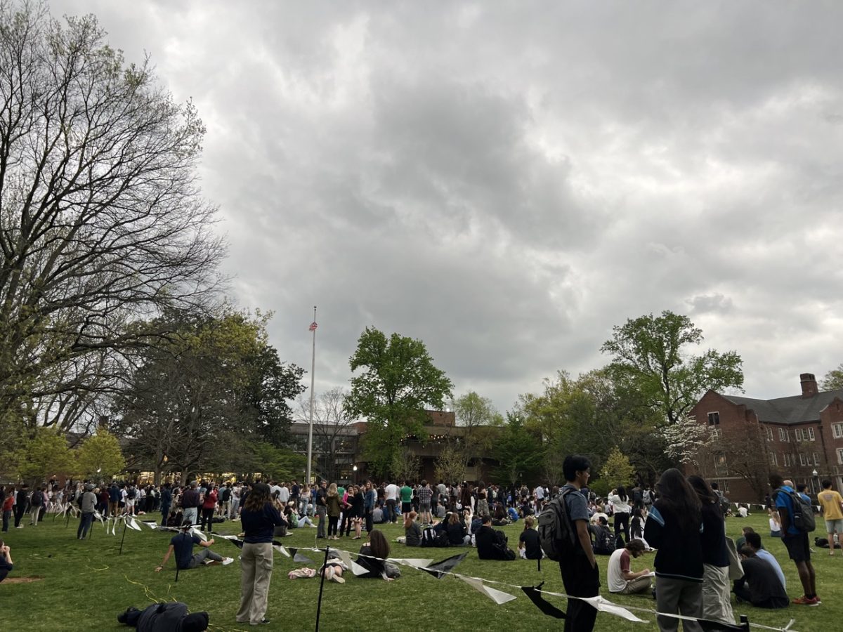 Vanderbilt community members gather on Alumni Lawn to watch the eclipse on April 8, 2024. (Hustler Staff/Rachael Perrotta)