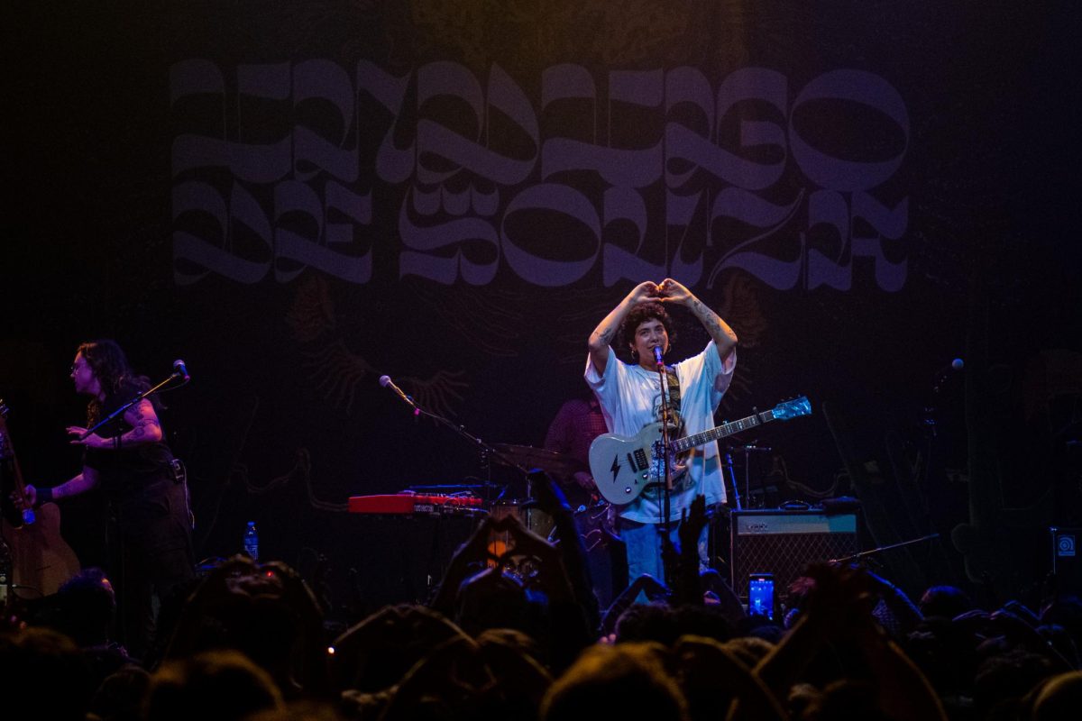 De Souza holds up a heart to the crowd at the end of the concert, as photographed on April 8, 2024. (Hustler Multimedia/Savannah Walske)