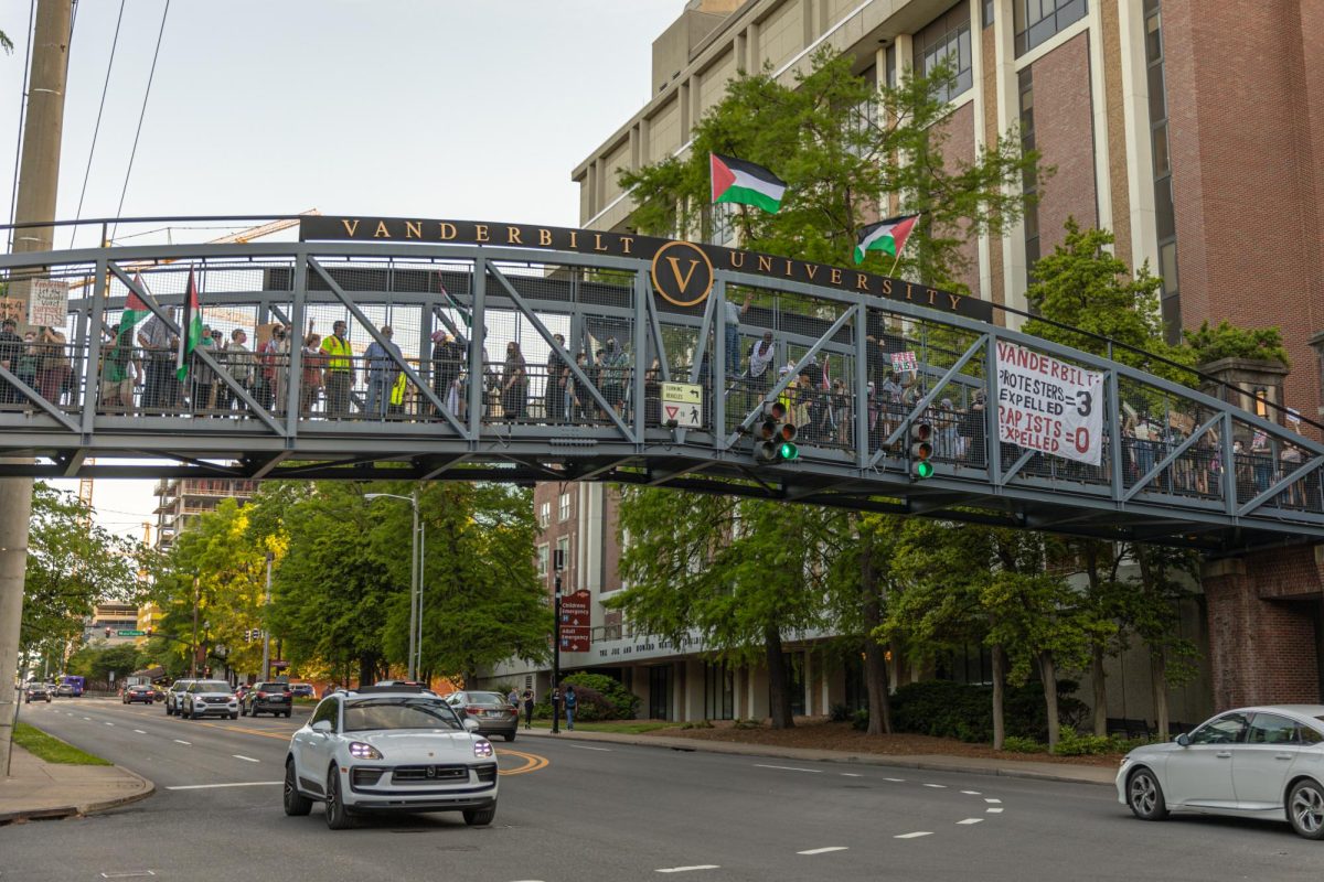 Protestors hang a banner that states VANDERBILT: PROTESTERS EXPELLED = 3, RAPISTS EXPELLED = 0 as they march across Vanderbilt University campus towards the Wyatt Center, as photographed on May 1, 2024. (Hustler Multimedia/Josh Rehders)