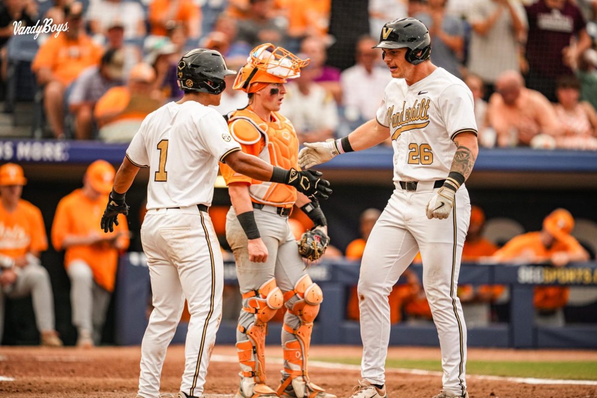 Braden Holcomb celebrates with Matthew Polk after hitting a home run against Tennessee in the SEC Tournament. As photographed on May 25, 2024. (Vanderbilt Athletics)