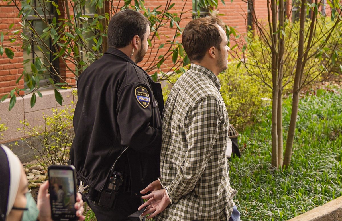 Eli Motycka, a Nashville Scene reporter, is arrested by the Vanderbilt University Police Department near Kirkland Hall at Vanderbilt University, as photographed on March 26, 2024. (Hustler Multimedia/Josh Rehders