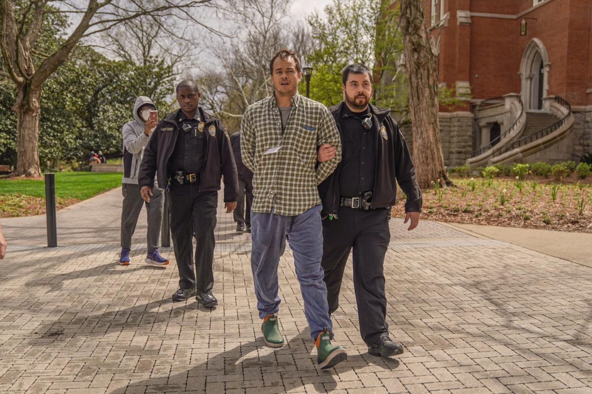 Eli Motycka, a Nashville Scene reporter, gets arrested by VUPD on Vanderbilt Campus, as photographed on March 26, 2024. (Hustler Multimedia/Josh Rehders)