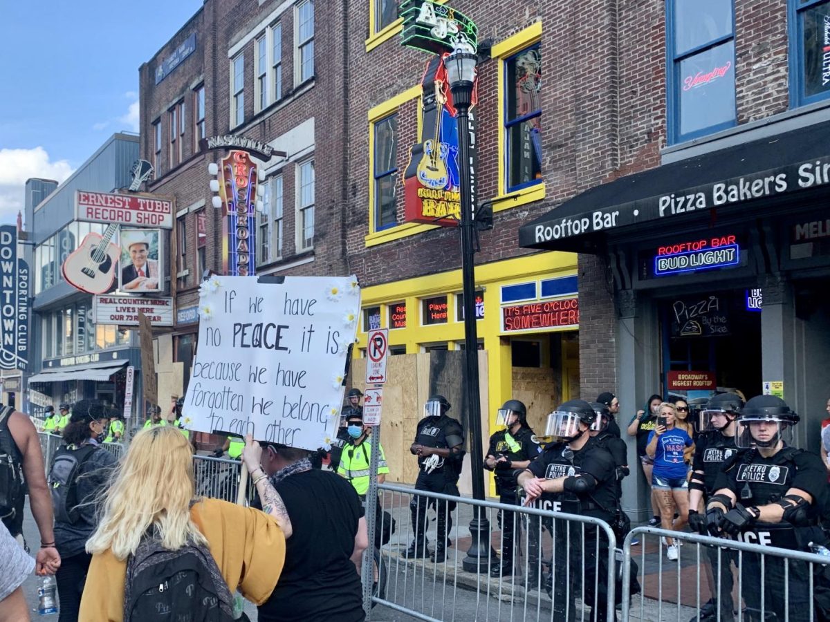 Photograph of a group of protesters passing through Broadway as police officers watch, as photographed on June 4, 2020. (Hustler Multimedia/Krista Panageas)