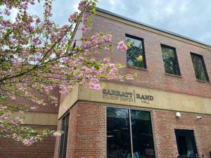 Photograph of Rand Hall with pink flowers in the foreground, as photographed on March 31, 2024. (Hustler Multimedia/George Albu)