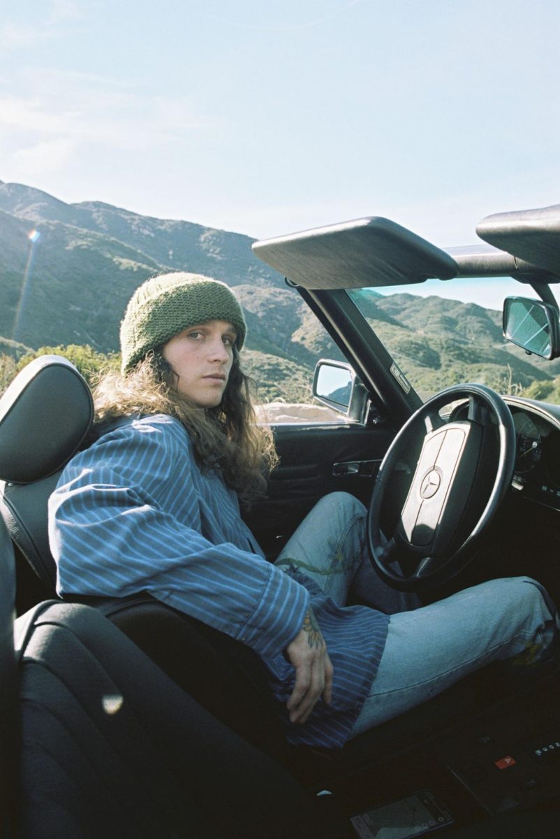 Briston Maroney poses in a car. (Photo courtesy of Natalie Hewitt/Atlantic Records)