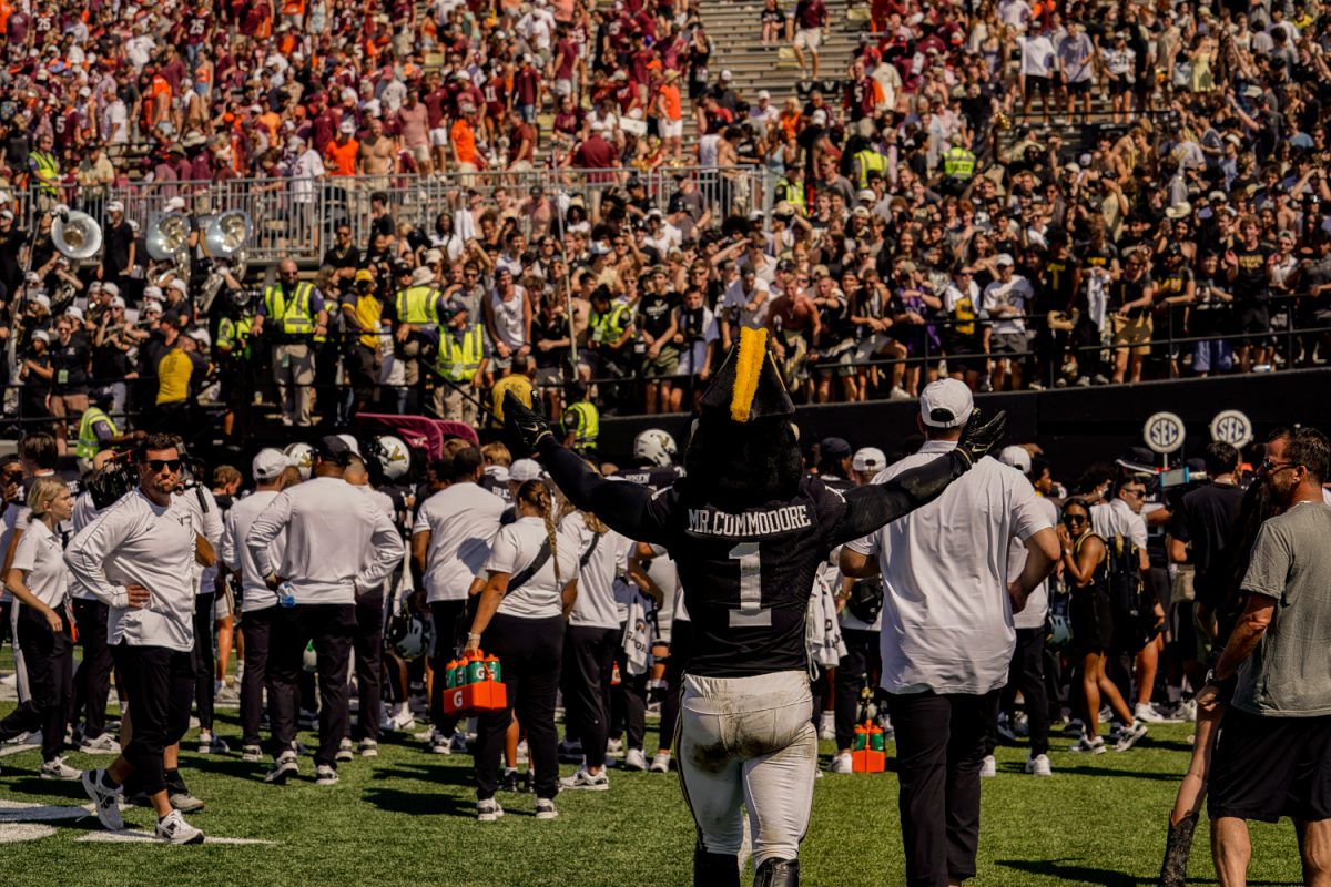 Mr. C celebrates with the student section after Vanderbilt's overtime win over Virginia Tech, as photographed on Aug. 31, 2024. (Hustler Multimedia/Miguel Beristain)