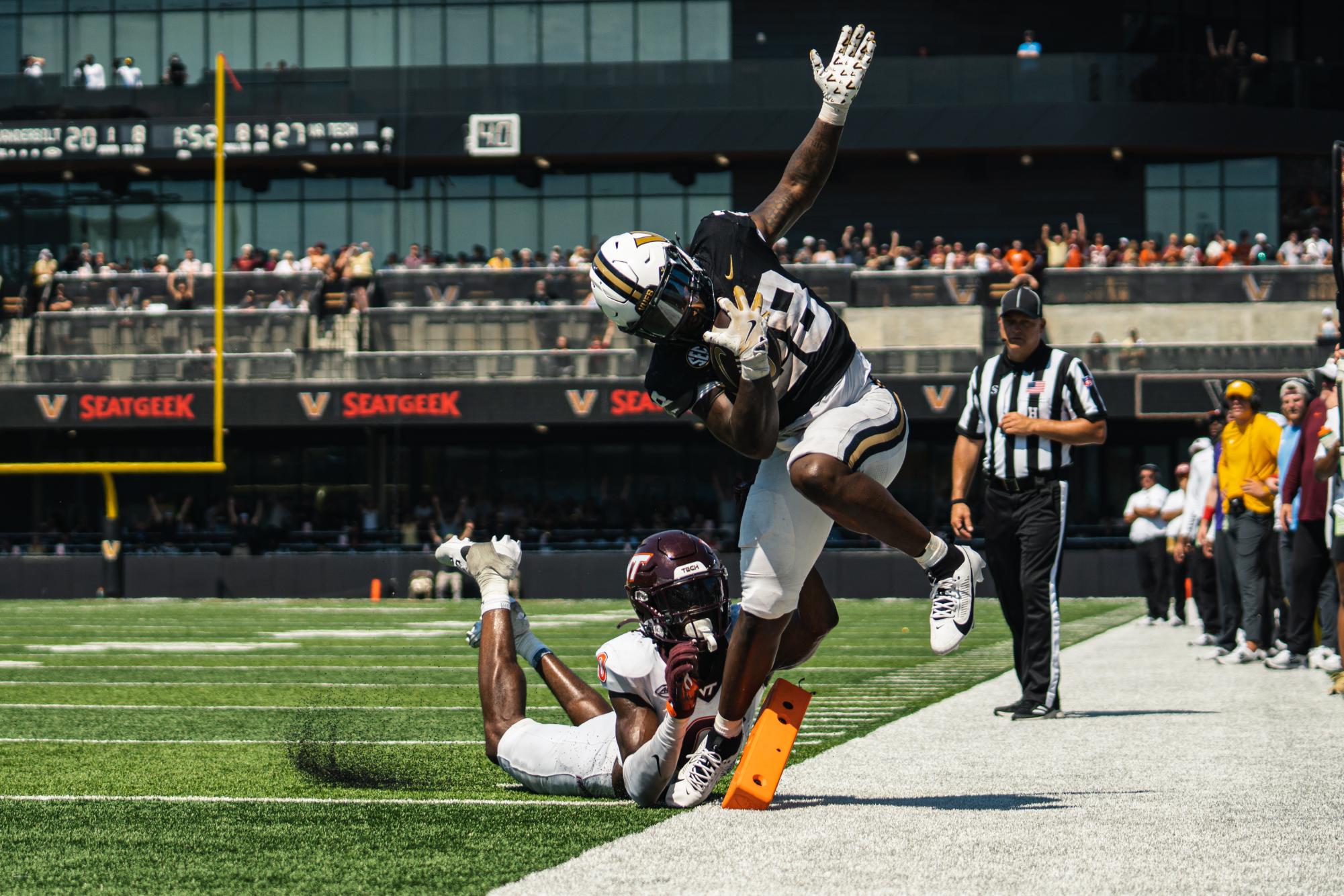 Sedrick Alexander tip-toe's the sideline and scores against Virginia Tech, as photographed on Aug. 31, 2024. (Hustler Multimedia/Vince Lin)