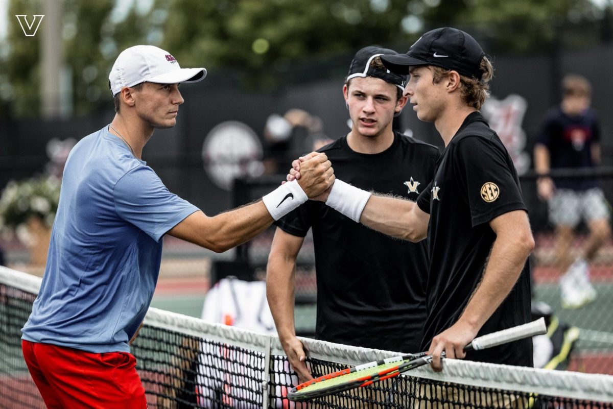 Henry Ruger shakes hands with an opponent after a match at the SEC Challenge. As photographed on Sept. 13, 2024. (Vanderbilt Athletics)