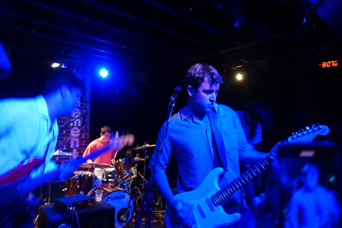 Will Harford on guitar, with Billy Apostolou on bass and Chris Conte on drums behind, as photographed on Sept. 12, 2024. (Hustler Multimedia/Amy Grill)