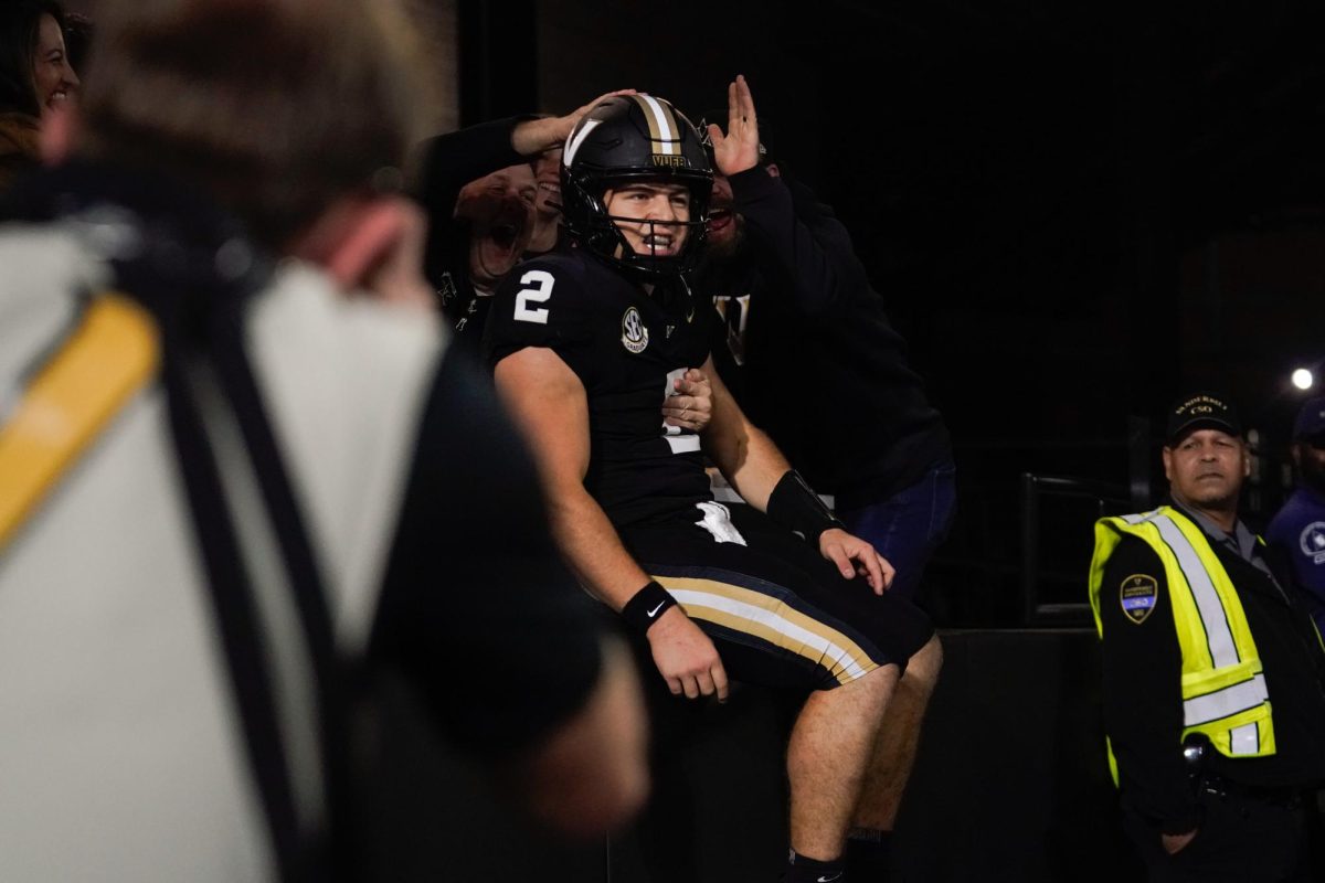 Fans celebrate with Pavia after his rushing touchdown in the fourth-quarter, as captured on Oct. 19, 2024. (Hustler Multimedia/Lana English)