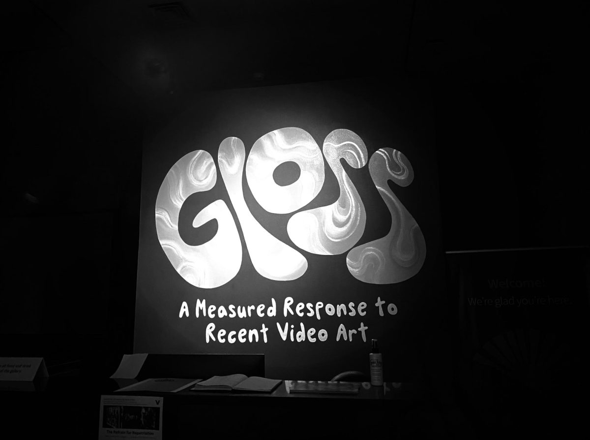 Black-and-white photograph of a sign that reads “Gloss” in bold letters, as photographed on Sept. 27, 2024. (Hustler Multimedia/George Albu) 