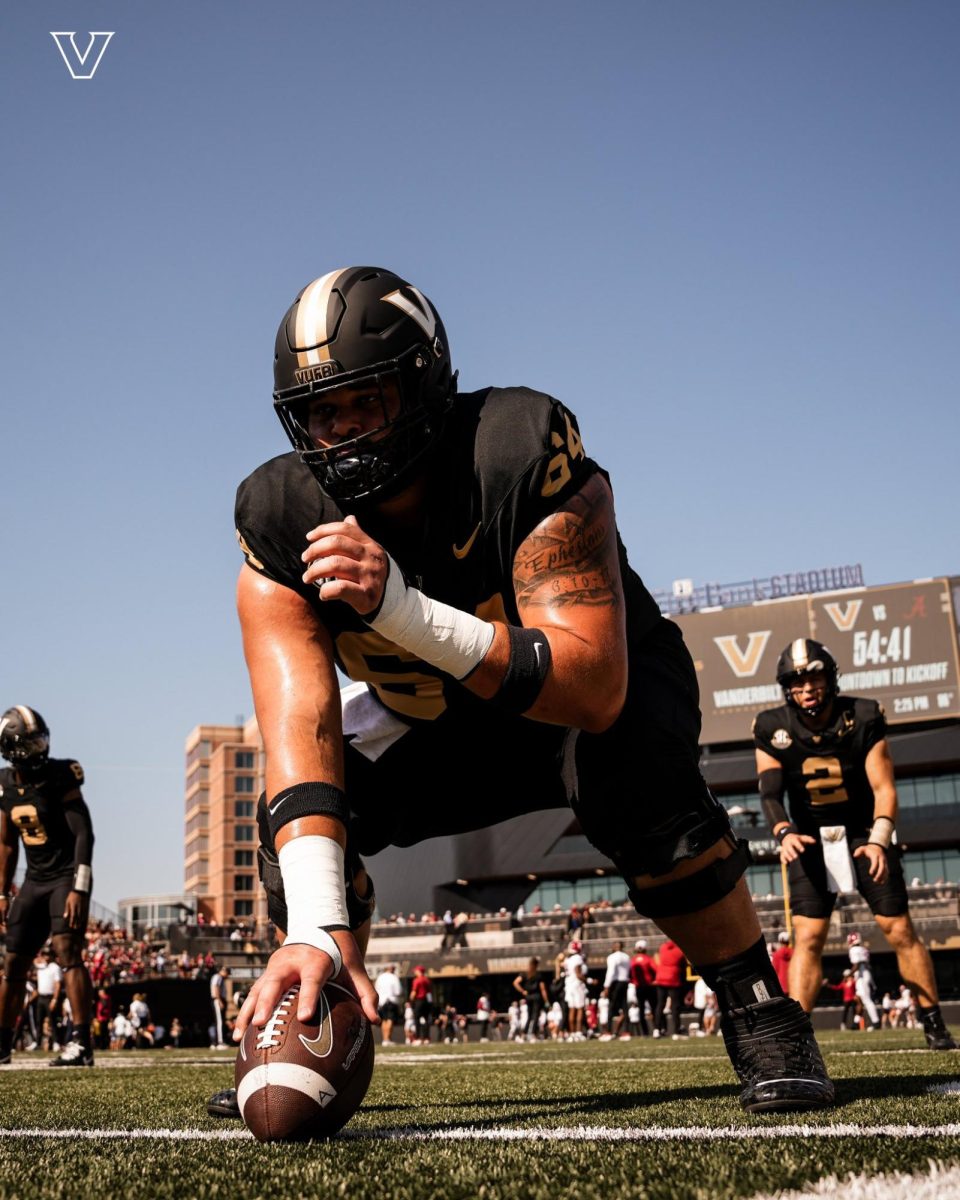 Xavier Castillo practices snapping the ball pregame. (Vanderbilt Athletics)