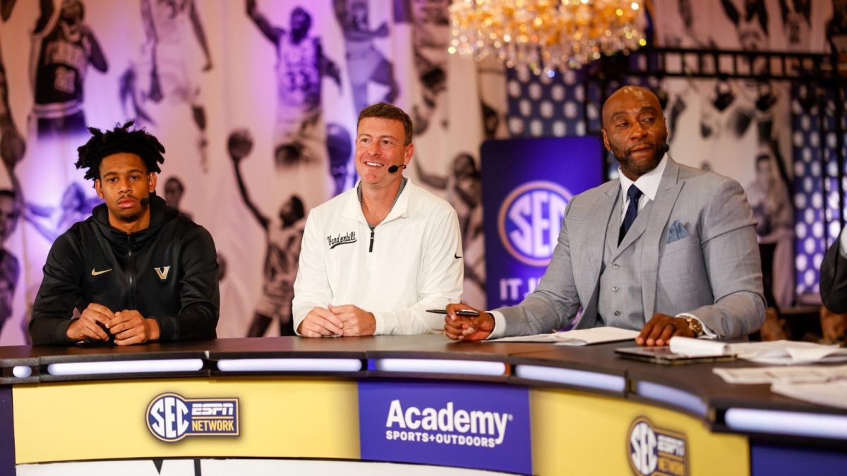 Vanderbilt Men's Basketball head coach Mark Byington (middle) talks to the media alongside player AJ Hoggard (left), as photographed on October 16, 2024. (Vanderbilt Athletics)