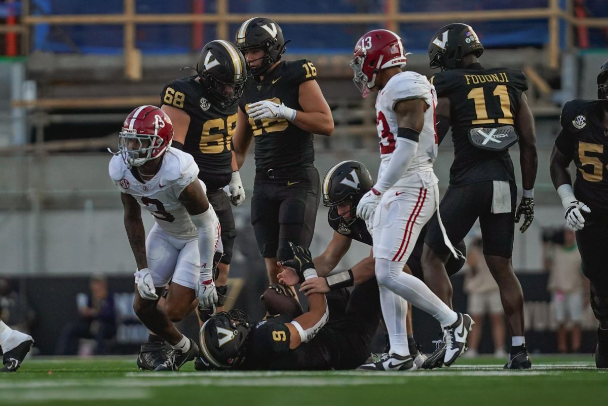 Diego Pavia picks Eli Stowers up after Stowers' catch against Alabama, as photographed on Oct. 5, 2024. (Hustler Multimedia/Nikita Rohila)