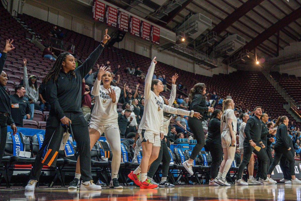 Vanderbilt's sideline celebrates a made 3-pointer against Columbai, as photographed on March 20, 2024. (Hustler Multimedia/Josh Rehders)