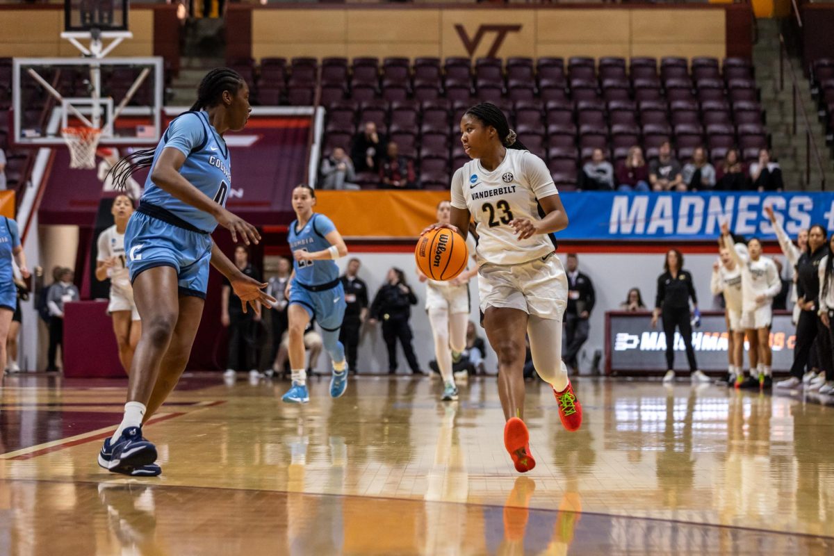 Iyana Moore dribbles up the court, as photographed on March 30, 2024. (Hustler Multimedia/Josh Rehders)