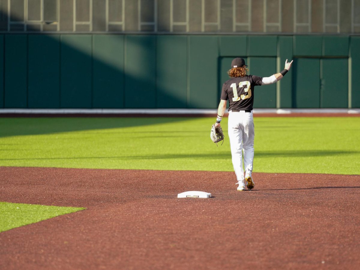 Jonathan Vastine signals two outs, as photographed on Oct. 4, 2024. (Hustler Staff/Connor Campbell)