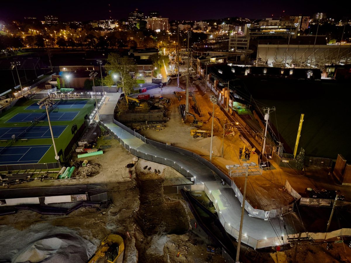 A well-lit path built from a mixture of asphalt and previously-used tennis courts cleaves through constructional mayhem between McGugin Center and Branscomb Quadrangle, as captured on Oct. 14, 2024. (Hustler Multimedia/Royce Yang)