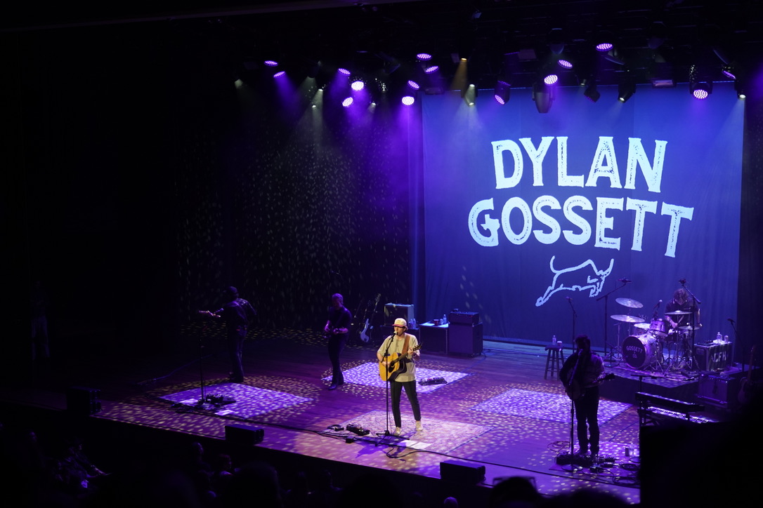 Dylan Gossett performs on stage against a backdrop with his name, as photographed on Oct. 23, 2024. (Hustler Multimedia/Sara West)