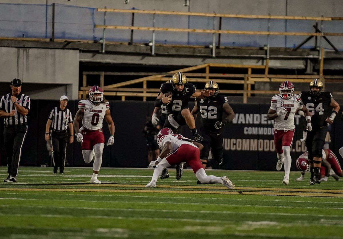 Diego Pavia hurdles a South Carolina defender, as photographed on Nov. 9, 2024. (Hustler Multimedia/Miguel Beristain)